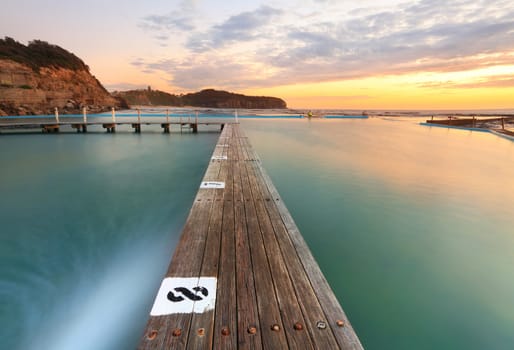 North Narrabeen Tidal Pool from Lane 8, Narrabeen Beach Sydney, Australia, at sunrise. Focus to foreground