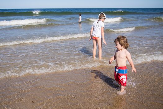 Kids playing in the water at the sea