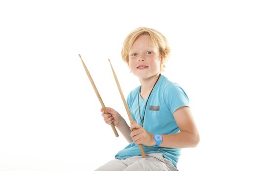 very young drummer against white background