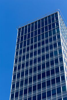 part of modern office business building against blue sky