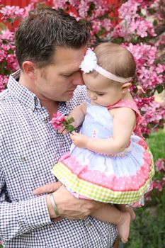 Father and daughter playing outside on the farm