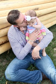 Father and daughter playing outside on the farm 