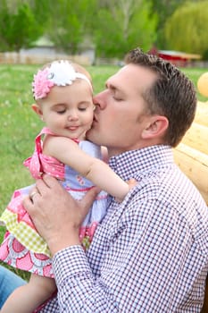 Father and daughter playing outside on the farm 