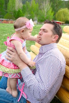 Father and daughter playing outside on the farm 