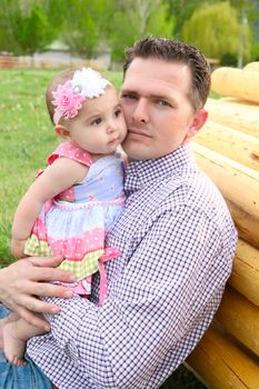 Father and daughter playing outside on the farm 