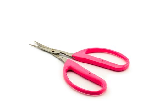 Pink scissors isolated on white background