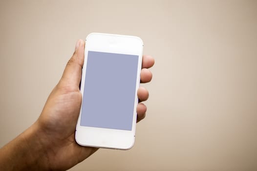 closeup photo of a hand holding cell phone 