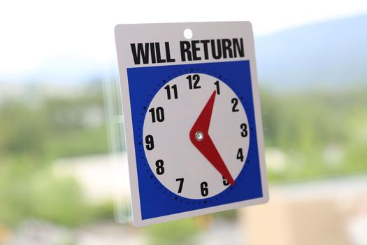 will return sign with nature background 