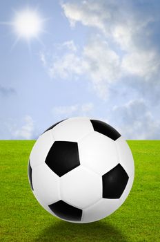 Football with field and sky background