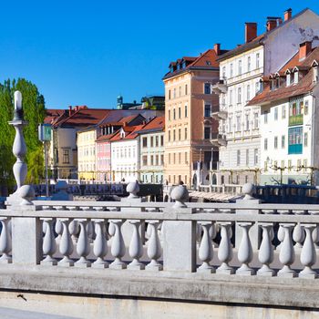 Romantic medieval Ljubljana's city center, the capital of Slovenia, Europe. Gallus bank of river Ljubljanica with Cobblers' Bridge or the Shoemakers' Bridge.