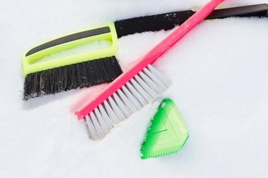 winter and equipment concept - variety of snow cleaning equipment on snow