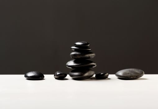 spa, health and beauty concept - closeup of hot massage stones