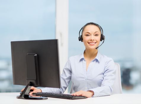 business, communication and call center concept - friendly female helpline operator with headphones