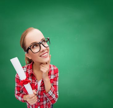 university and education concept - smiling woman in black eyeglasses with diploma