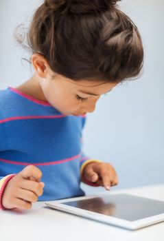 education, technology and internet concept - little girl with tablet pc