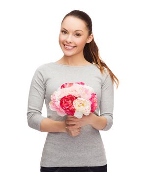 holidays, love and flowers concept - young woman with bouquet of flowers