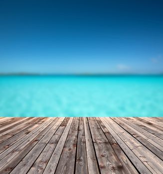 background and texture concept - wooden floor and blue sea