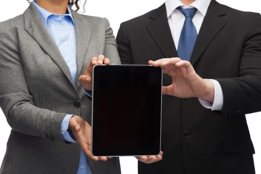 business, technology and internet concept - businessman and businesswoman with blank black tablet pc screen