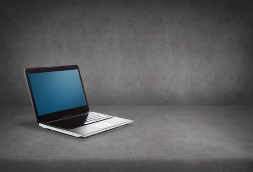 technology and advertisement concept - laptop computer with blank black screen