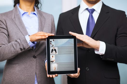 business, technology, internet and office concept - businessman and businesswoman with blank black tablet pc screen in office