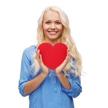 happiness, health and love concept - smiling woman with red heart