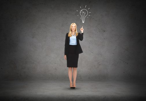 business and education concept - attractive young businesswoman with her finger up