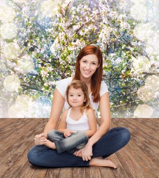 childhood, parenting and relationship concept - happy mother with adorable little girl