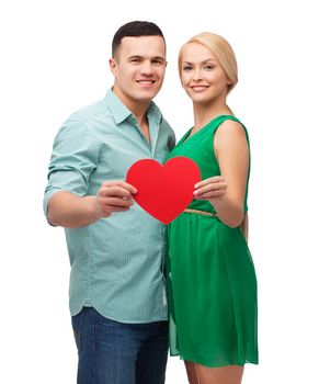 couple, love and family concept - smiling couple holding big red heart