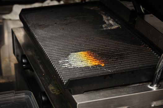 dirty electrical grill in real industrial kitchen