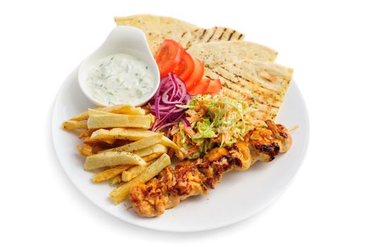 one portion of french fries, chicken kebab, salad and roasted pita