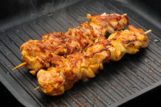 preparation of chicken shish kebab on skewers