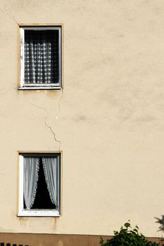 Facade of an old and damaged building.