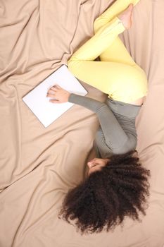 A young adult woman with a Laptop.