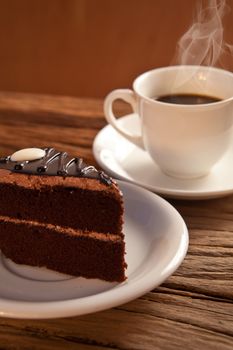 cake and coffee on old wood background