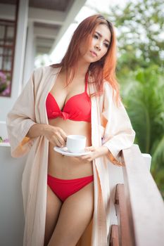 Portrait of Beautiful sexy asian woman holding cup