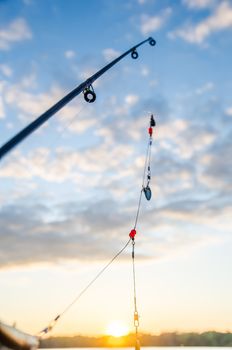 fishing on a lake before sunset