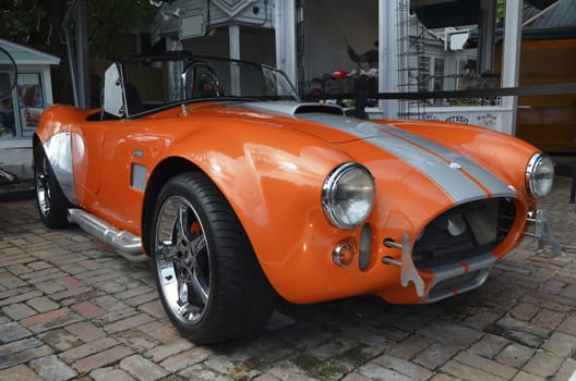 Fully restored Ford Cobra a classic sports car on display outside of a motorcycle shop on Duval Street in Key West,Florida Photographed in August 2012
