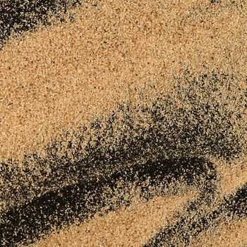 The sand on the black background close-up