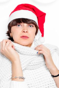 Charming brunette in cap Santa Claus