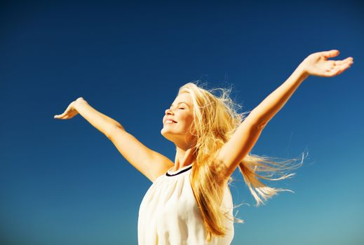 lifestyle concept - beautiful happy woman enjoying summer outdoors