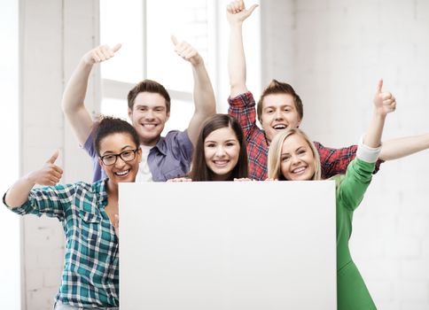 education concept - group of students at school with blank white board