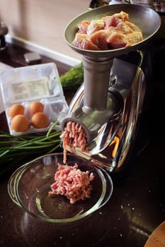 Meat grinder close up, preparation of forcemeat