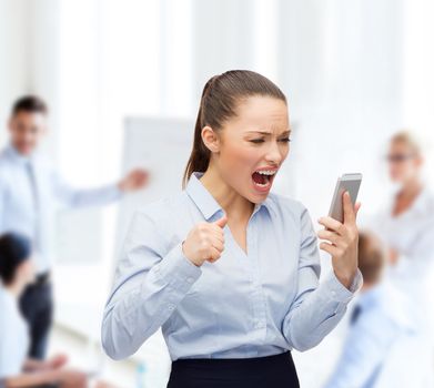 business, technology and education concept - screaming businesswoman with smartphone in office