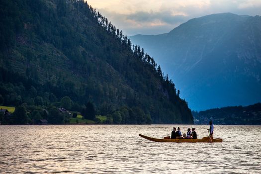 Small boat flowing on the lake in high Alps Austria