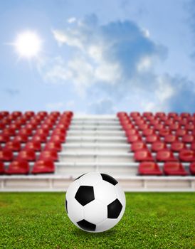 Soccer ball in sport arena with nice sky background