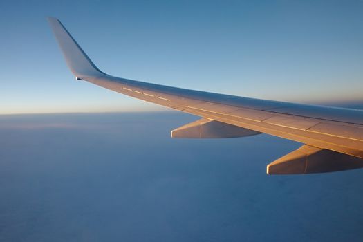 Sunrise view from an aircraft - Never forget to book a seat by the window