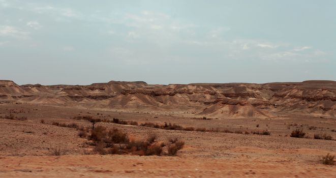 An Egyptian Desert And Mysty Sky in the daylight