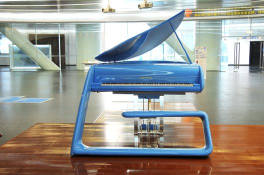 Blue hi-tech grand piano in the hall of Canton tower