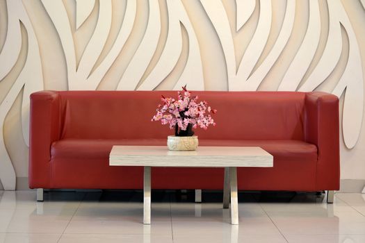 flower vase and red sofa that used in home or office