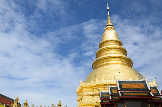Travel landmark, the Golden Pagoda at Wat Phra That Hariphunchai in Lamphun province